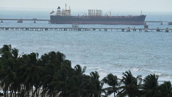 Evana, an oil tanker, is docked at El Palito port in Puerto Cabello, Venezuela, Sunday, Dec. 21, 2025.  - Sputnik भारत