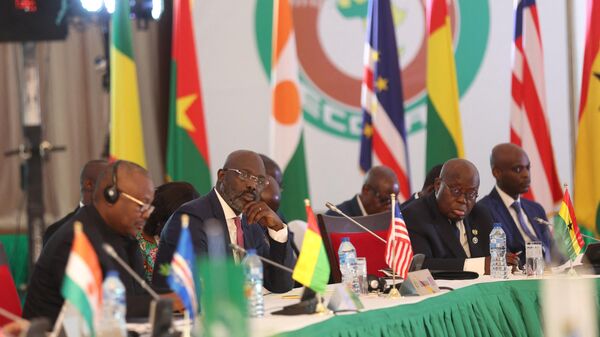 Liberiaґs President George Weah (2nd L) and Ghana President Nana Akufo-Addo (2nd R) react during the 64th Economic Community of West African States (ECOWAS) Head of States and Government ordinary session in Abuja on December 10, 2023 - Sputnik India