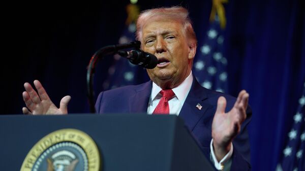 President Donald Trump speaks to House Republican lawmakers during their annual policy retreat, Tuesday, Jan. 6, 2026, in Washington - Sputnik भारत