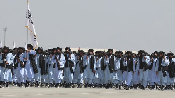 Taliban fighters march during a military parade to mark the third anniversary of the withdrawal of U.S.-led troops from Afghanistan, in Bagram Air Base in the Parwan Province of Afghanistan, Wednesday, Aug. 14, 2024. - Sputnik India