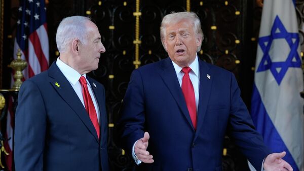 President Donald Trump speaks to reporters as he greets Israel's Prime Minister Benjamin Netanyahu at his Mar-a-Lago club, Monday, Dec. 29, 2025, in Palm Beach, Fla - Sputnik India