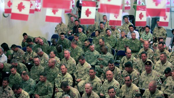 US and Canadians soldiers attend a transfer of command authority ceremony in Kandahar airbase in Afghanistan, Thursday, July 7, 2011 - Sputnik भारत