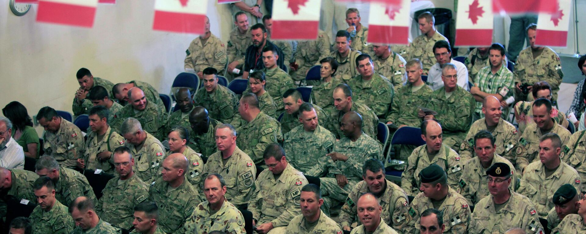 US and Canadians soldiers attend a transfer of command authority ceremony in Kandahar airbase in Afghanistan, Thursday, July 7, 2011 - Sputnik भारत, 1920, 19.01.2026