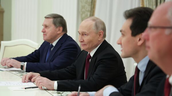 Russian President Vladimir Putin, center, Russian Presidential foreign policy adviser Yuri Ushakov, left, and Russian Direct Investment Fund CEO Special Presidential Representative for Investment and Economic Cooperation with Foreign Countries Kirill Dmitriev, right, attend the talks with U.S. special envoy Steve Witkoff and Jared Kushner, U.S. President Donald Trump's son-in-law, at the Senate Palace of the Kremlin in Moscow, Russia, Tuesday, Dec. 2, 2025. (Alexander Kazakov, Sputnik, Kremlin Pool Photo via AP) - Sputnik India