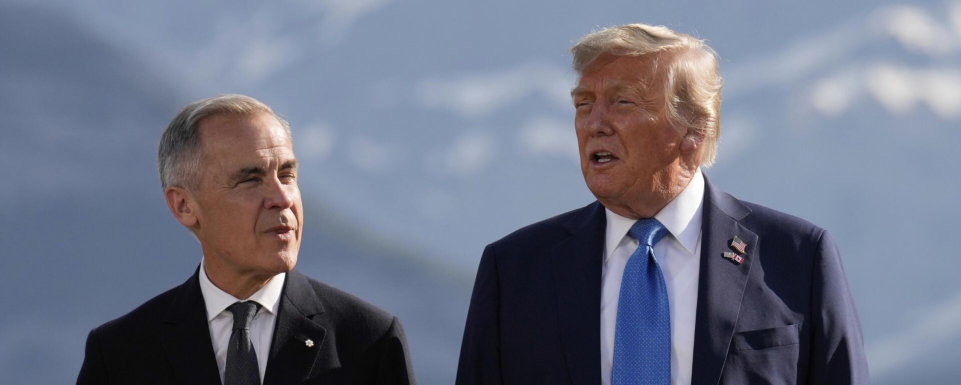 Canada's Prime Minister Mark Carney, listens as President Donald Trump speaks during a group photo at the G7 Summit, Monday, June 16, 2025, in Kananaskis, Canada - Sputnik India, 1920, 25.01.2026