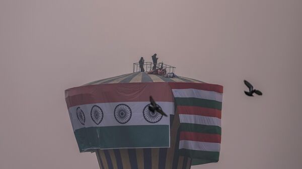 Indian policemen stand guard on top of a giant water tank in Srinagar, Friday, Jan. 26 , 2024. - Sputnik India