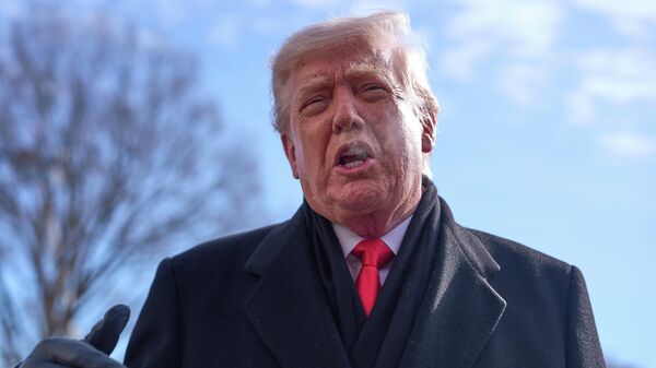 President Donald Trump speaks with reporters before boarding Marine One on South Lawn of the White House, Tuesday, Jan. 27, 2026, in Washington - Sputnik भारत