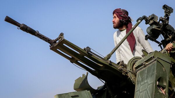 A Taliban soldier stands next to an anti-aircraft gun while on lookout for Pakistani fighter jets, in Khost province, Afghanistan, February 27, 2026. - Sputnik India