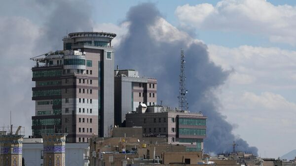 Smoke rises up after a strike in Tehran, Iran, Sunday, March 1, 2026.  - Sputnik India