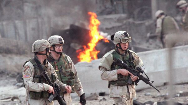 U.S. soldiers secure the site after an explosion in Baghdad, Wednesday, Jan. 19, 2005. A car bomb exploded near the Australian Embassy in central Baghdad on Wednesday, killing two people and wounding four, police and witnesses said. Australia said no embassy personnel were killed or hurt in the explosion - Sputnik India