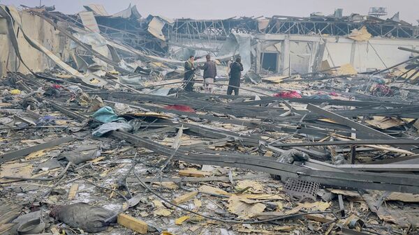 Media personnel work at the site of a drug users rehabilitation hospital destroyed in what the Taliban said was a Pakistani air strike in Kabul, Afghanistan, March 17, 2026. - Sputnik भारत