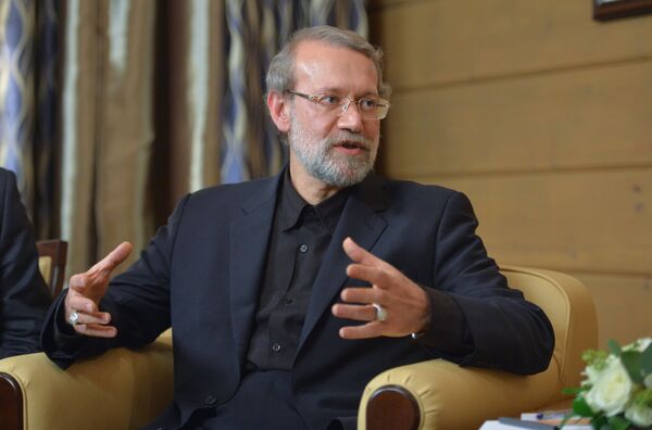 Speaker of the Islamic Consultative Council (parliament) of the Islamic Republic of Iran Ali Larijani during a meeting with Russian President Vladimir Putin following the 12th annual meeting of the Valdai International Discussion Club. File photo - Sputnik भारत