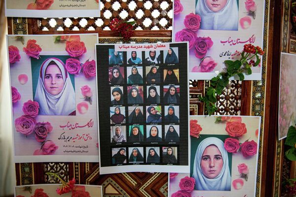 Portraits of school children from the Shajarah Tayyebeh Elementary School in Minab, who were killed in a U.S strike are displayed during a press conference by Iranian Ambassador to Tunisia Massoud Hosseinian, in Tunis, Tunisia, Thursday, March 12, 2026. (AP Photo/Ons Abid) - Sputnik भारत
