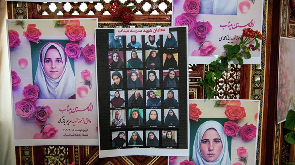 Portraits of school children from the Shajarah Tayyebeh Elementary School in Minab, who were killed in a U.S strike are displayed during a press conference by Iranian Ambassador to Tunisia Massoud Hosseinian, in Tunis, Tunisia, Thursday, March 12, 2026. (AP Photo/Ons Abid) - Sputnik India