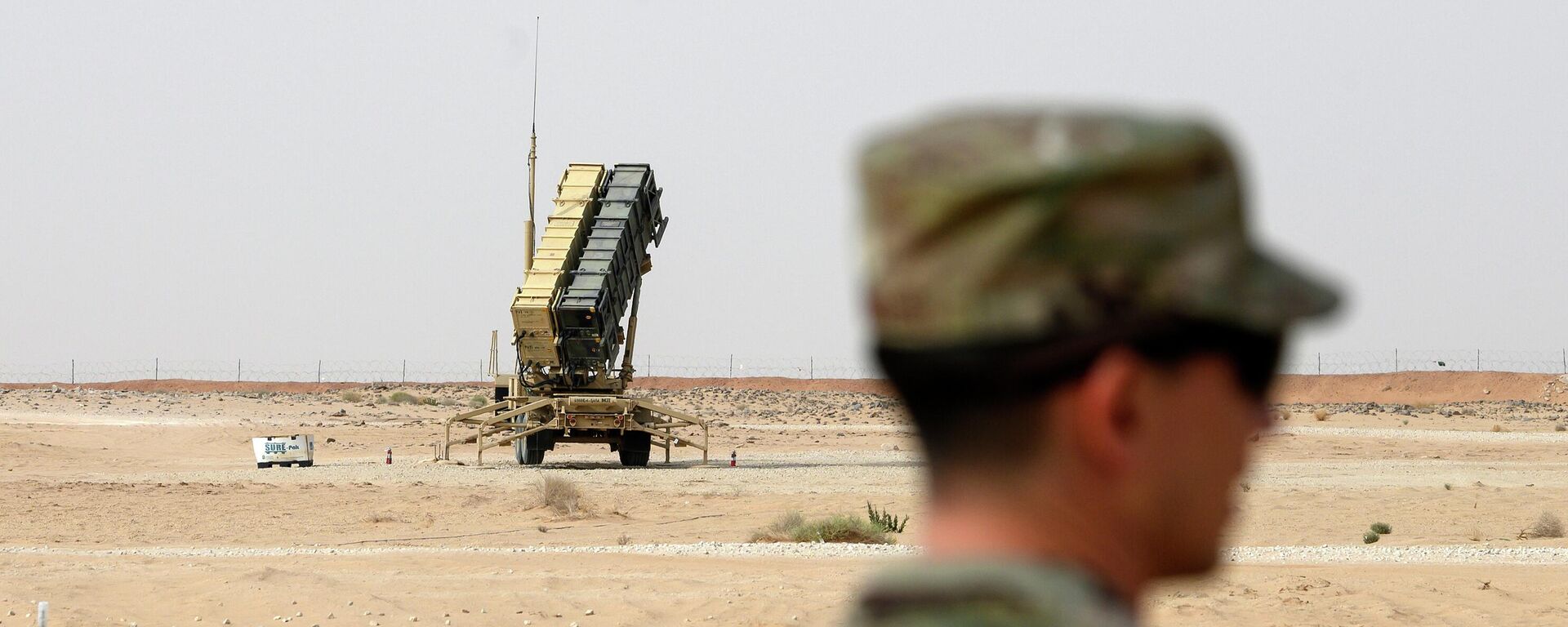 FILE - A member of the U.S. Air Force stands near a Patriot missile battery at the Prince Sultan air base in al-Kharj, central Saudi Arabia, on Feb. 20, 2020. The U.S. has transferred a significant number of Patriot antimissile interceptors to Saudi Arabia in recent weeks as the Biden administration looks to ease what has been a point of tension in the increasingly complicated U.S.-Saudi relationship.   (Andrew Caballero-Reynolds/Pool via AP, File) - Sputnik India, 1920, 11.05.2026
