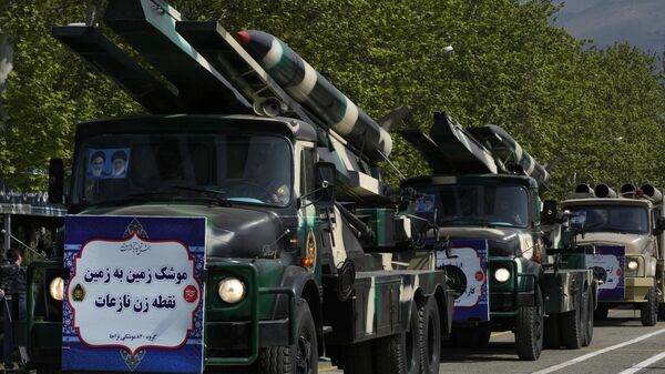 Missiles are carried on trucks during Army Day parade at a military base in northern Tehran - Sputnik भारत