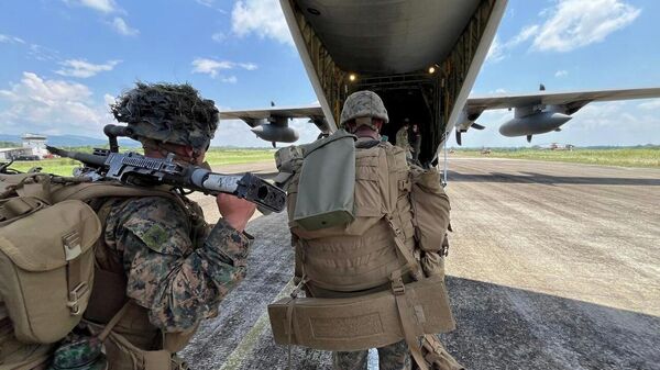 U.S. soldiers board a U.S. C130 military plane at Lal-lo, Cagayan International Airport, northern Philippines as part of Philippines and U.S. joint military drills called Balikatan or shoulder to shoulder, on Saturday April 26, 2025.  - Sputnik India