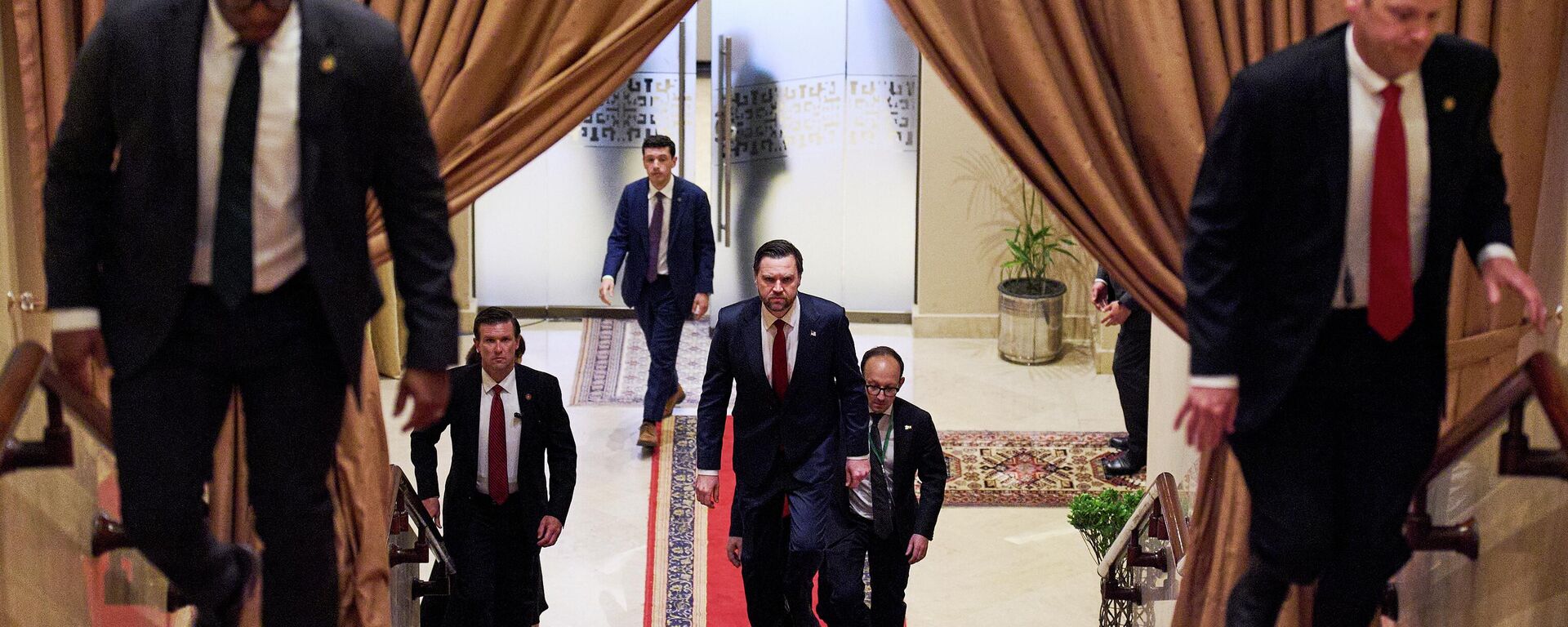 U.S. Vice President JD Vance, center, walks up a flight of stairs to meet with Pakistan's Prime Minister Shehbaz Sharif, Saturday, April 11, 2026, in Islamabad, for talks about Iran. - Sputnik India, 1920, 12.04.2026