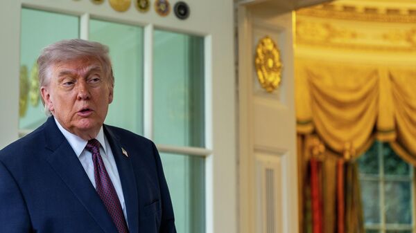 President Donald Trump speaks with reporters outside the Oval Office of the White House, Monday, April 13, 2026, in Washington.  - Sputnik भारत