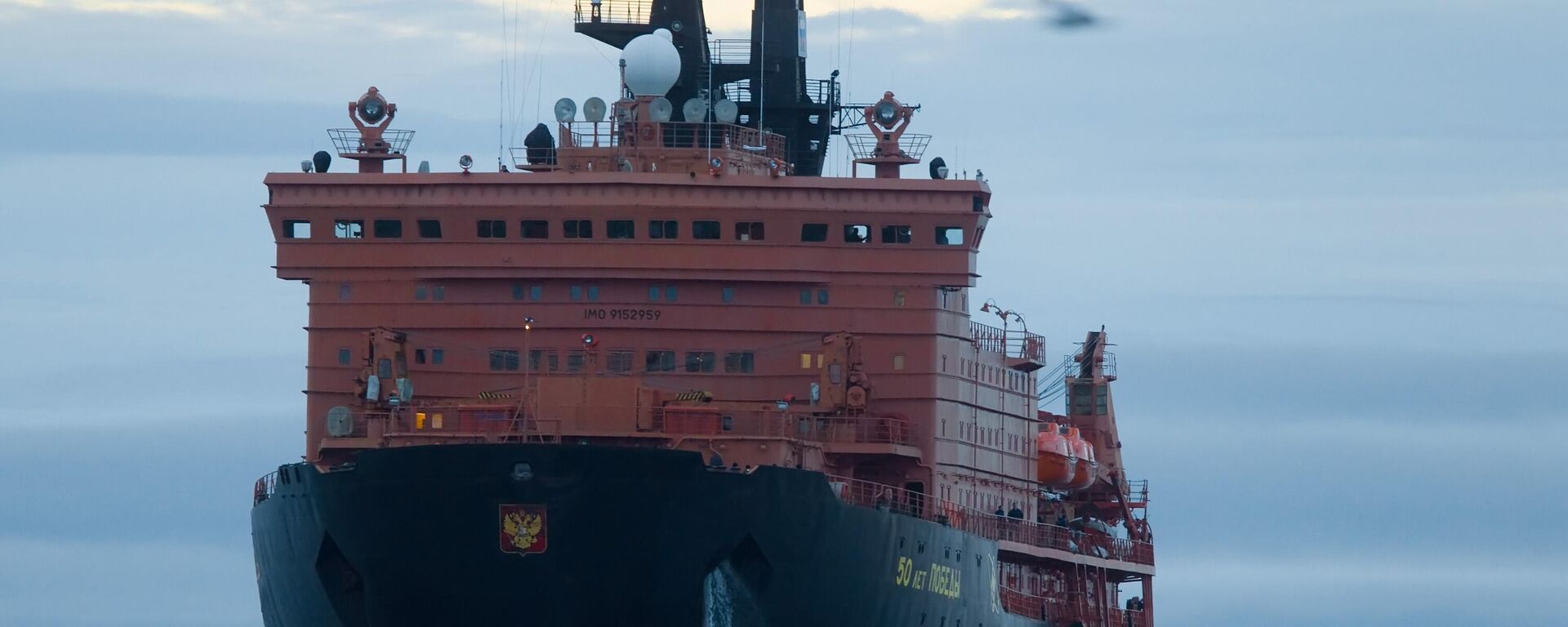 Fiftieth Anniversary of Victory nuclear powered icebreaker escorting the Baltica tanker of Sovcomflot along the Northern Sea Route from Murmansk to China's Ningbo harbor. - Sputnik India, 1920, 22.04.2026