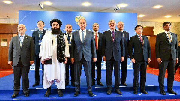 From left to right: Iranian Ambassador to Afghanistan Hassan Kazemi Qomi, Acting Afghan Foreign Minister, member of the Taliban* leadership Amir Khan Muttaqi, Russian Foreign Minister Sergei Lavrov, Russian Presidential Special Representative for Afghanistan Zamir Kabulov and other officials at a joint photo session as part of the 6th meeting of the Moscow format of consultations on Afghanistan. October 4, 2024. - Sputnik भारत