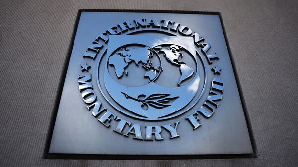 A sign with the International Monetary Fund logo on the wall of the IMF building - Sputnik भारत