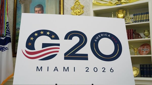 A sign for the G20 to be hosted in Miami in 2026 is displayed as President Donald Trump speaks in the Oval Office of the White House, Friday, Sept. 5, 2025, in Washington. - Sputnik India