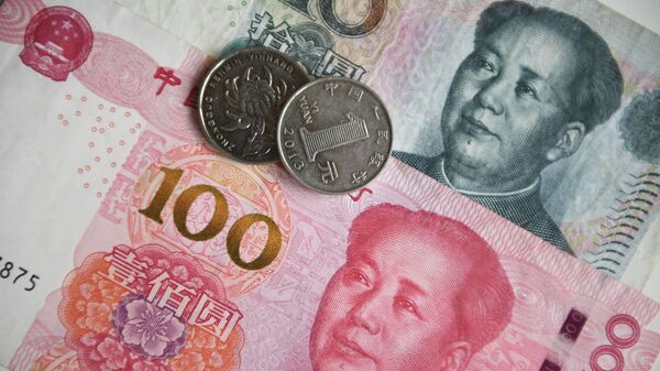 Chinese yuan coins and banknotes - Sputnik India