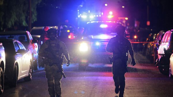FBI agents walk outside residence associated with Cole Tomas Allen, the suspect in the shooting incident at the annual White House Correspondents' Association dinner in Washington, D.C., in Torrance, California, U.S., April 25, 2026.  - Sputnik India