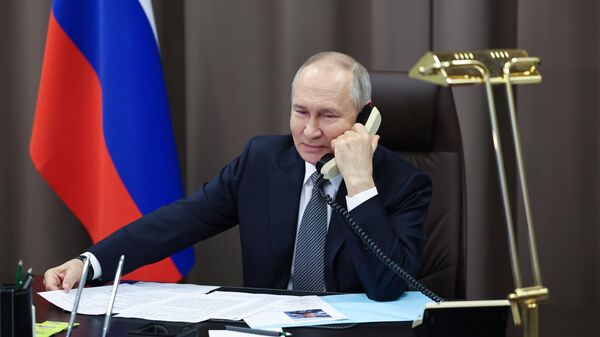 Russian President Vladimir Putin speaks on the phone. - Sputnik India