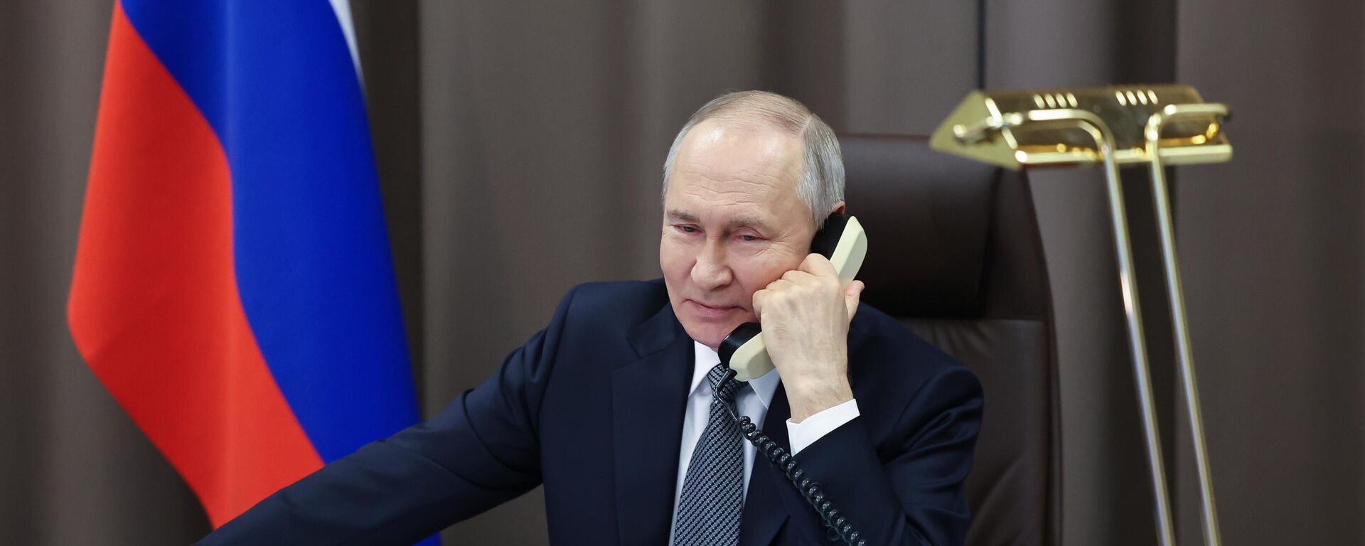 Russian President Vladimir Putin speaks on the phone. - Sputnik India, 1920, 29.04.2026