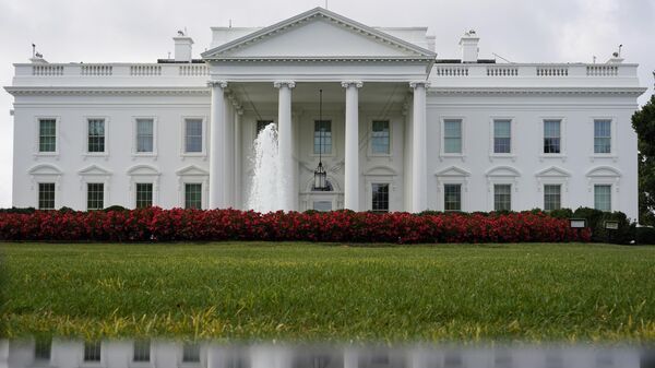 The White House is seen reflected in a puddle, Saturday, Sept. 3, 2022, in Washington.  - Sputnik भारत