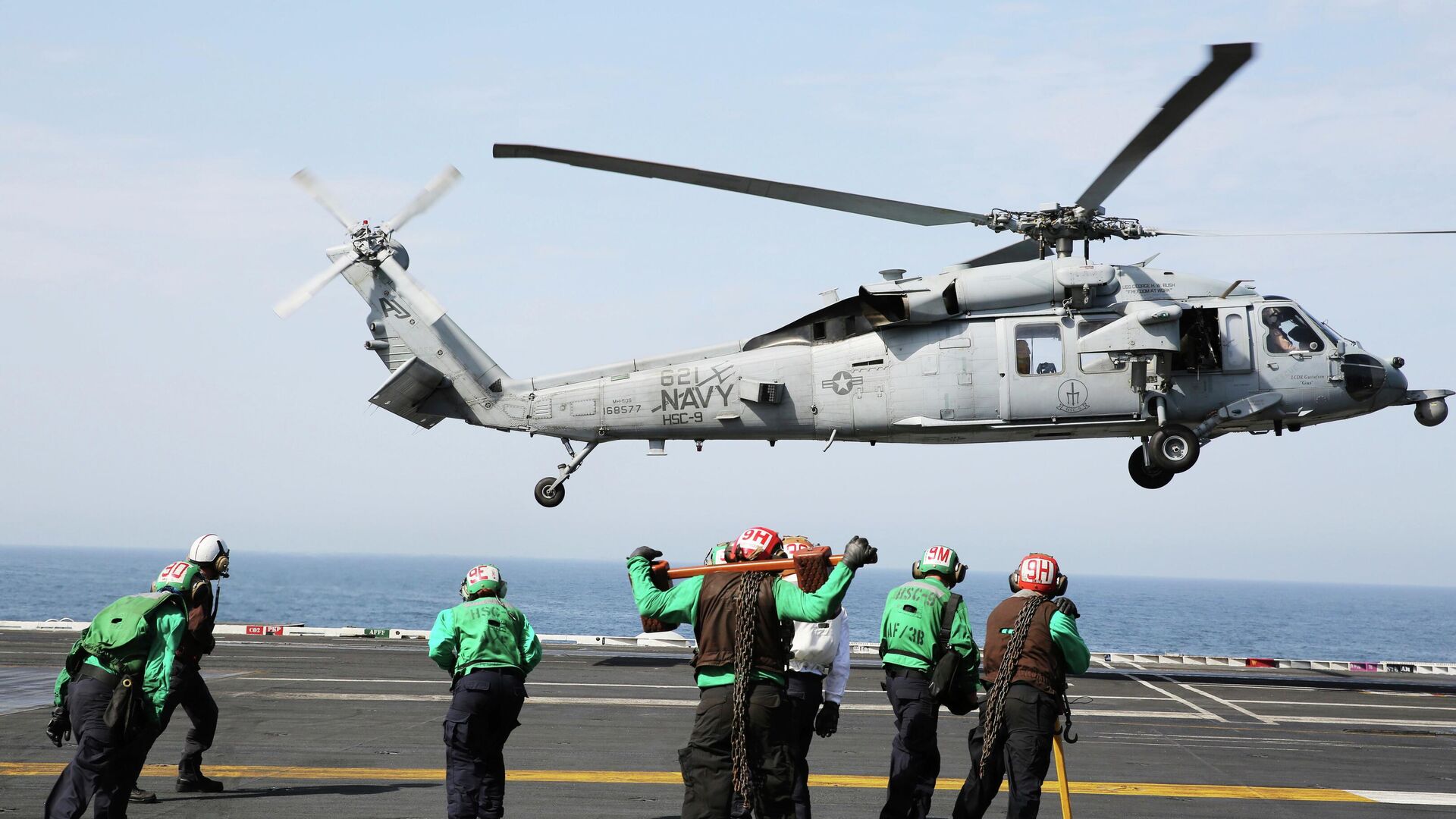 In this March 20, 2017 photograph, an MH-60 helicopter takes off from the USS George H.W. Bush as it travels toward the Strait of Hormuz.  - Sputnik भारत, 1920, 05.05.2026
