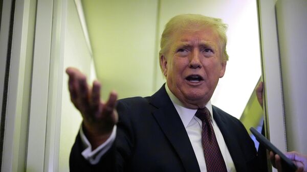 President Donald Trump speaks to reporters aboard Air Force One, Sunday, March 15, 2026, en route from West Palm Beach, Fla. to Joint Base Andrews, Md. - Sputnik भारत