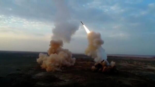 This video grab shows launching underground ballistic missiles by the Iranian Revolutionary Guard during a military exercise - Sputnik India