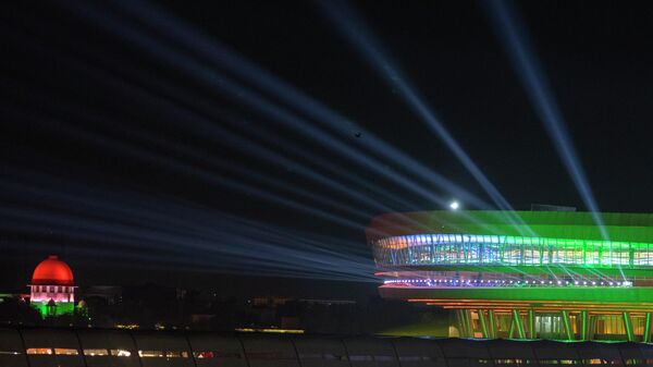 An Illuminated Bharat Mandapam Convention center, right, the main venue for the G20 summit is seen during the G20 summit in New Delhi,India, Saturday, Sept. 9, 2023. - Sputnik भारत
