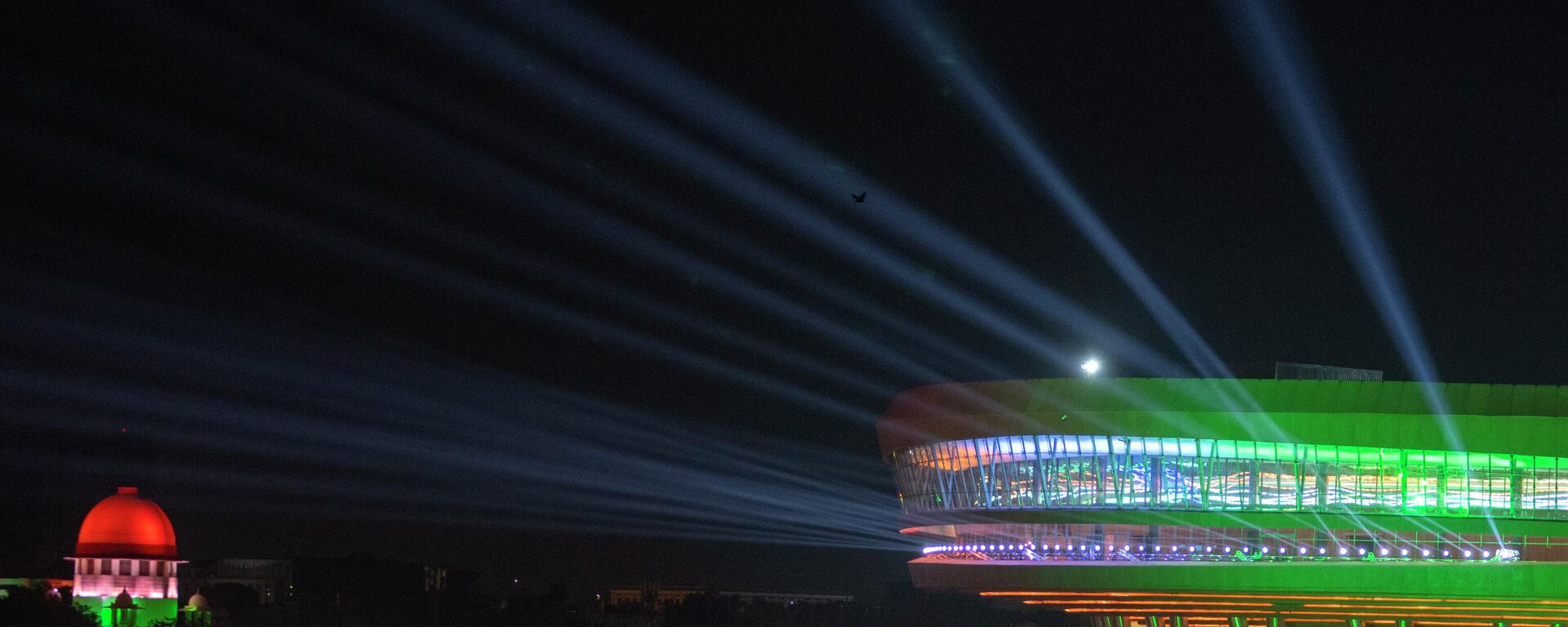 An Illuminated Bharat Mandapam Convention center, right, the main venue for the G20 summit is seen during the G20 summit in New Delhi,India, Saturday, Sept. 9, 2023. - Sputnik भारत, 1920, 14.05.2026