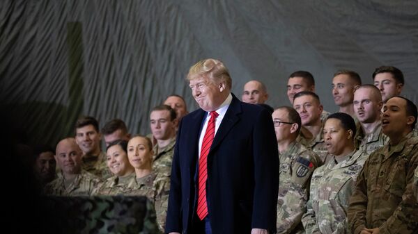In this Nov. 28, 2019, file photo President Donald Trump smiles before addressing members of the military during a surprise Thanksgiving Day visit at Bagram Air Field, Afghanistan - Sputnik भारत