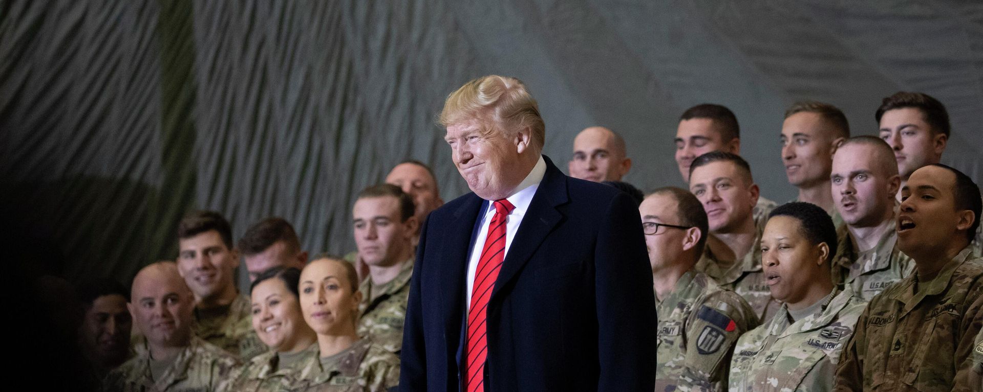 In this Nov. 28, 2019, file photo President Donald Trump smiles before addressing members of the military during a surprise Thanksgiving Day visit at Bagram Air Field, Afghanistan - Sputnik भारत, 1920, 18.07.2026