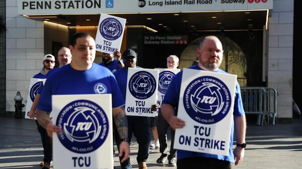 Long Island Rail Road workers walk on the picket line outside of Penn Station on the first day of their strike, Saturday, May 16, 2026, in New York - Sputnik India