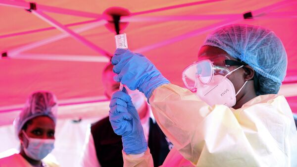 A health worker prepares to administer a vial of a vaccine against the Sudan strain of Ebola, during a trial, at Mulago Referral Hospital, in Kampala, Uganda Monday, Feb. 3, 2025 - Sputnik India