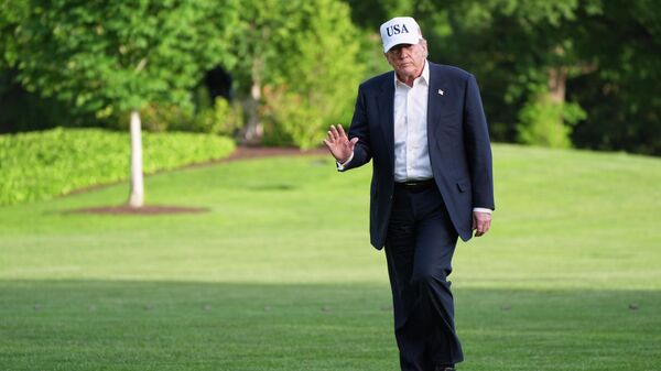 President Donald Trump walks across the South Lawn of the White House, Friday, May 15, 2026, in Washington, on return from Beijing where he met with China's President Xi Jinping - Sputnik भारत