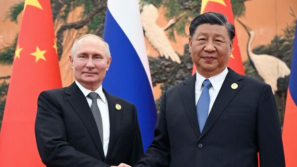 Chinese President Xi Jinping, right, and Russian President Vladimir Putin pose for a photo prior to their talks on the sidelines of the Belt and Road Forum in Beijing, China, on Wednesday, Oct. 18, 2023 - Sputnik India