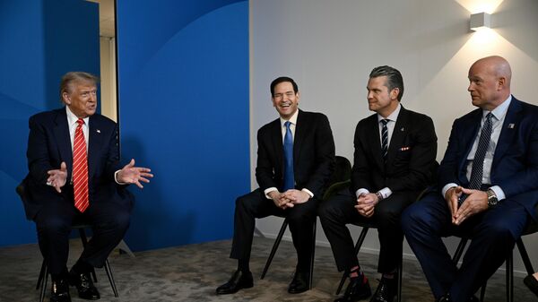 US President Donald Trump, left, speaks next to, from left, US Secretary of State Marco Rubio, US Defence Secretary Pete Hegseth and US' ambassador to NATO Matthew Whitaker, during a meeting with NATO Secretary General Mark Rutte at the NATO summit of heads of state and government in The Hague, Netherlands, Wednesday, June 25, 2025 - Sputnik India