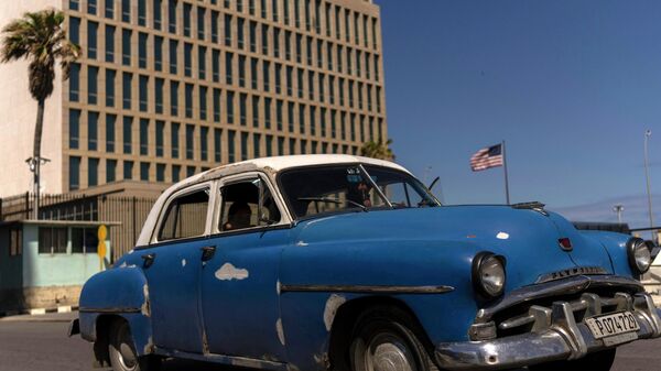 A classic American car drives past the United States Embassy, in Havana, Cuba, Thursday, March 3, 2022. - Sputnik भारत
