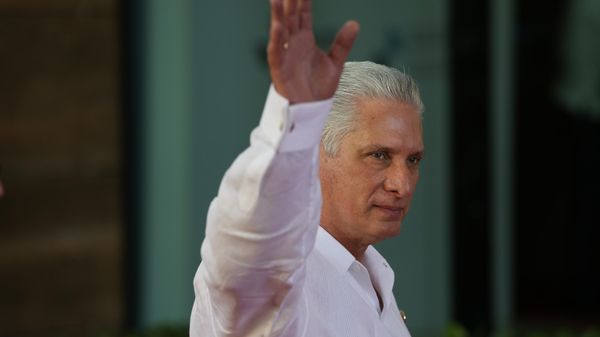 Cuba's President Miguel Diaz-Canel waves as he arrives for a session during the 28th Ibero-American Summit in Santo Domingo, Dominican Republic, March 25, 2023. - Sputnik भारत