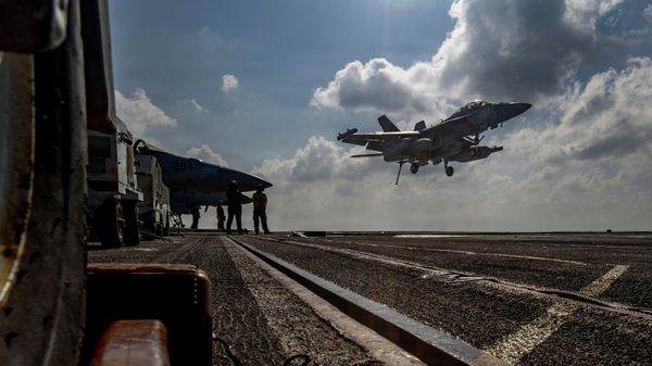 This handout image from the US Navy shows an EA-18G Growler landing on the flight deck of the Nimitz-class aircraft carrier USS Abraham Lincoln in the Indian Ocean on Jan. 23, 2026 - Sputnik India