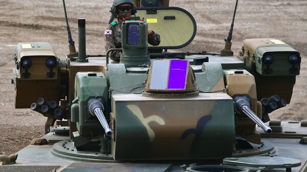A South Korean soldier sits on the top of a K30 Biho, twin 30mm self-propelled anti-aircraft gun - Sputnik India