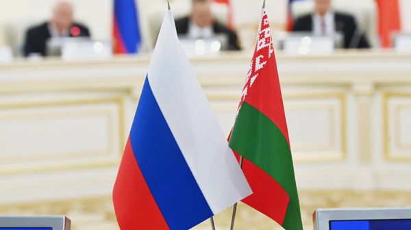 Russian and Belarusian national flags are pictured during a meeting of the High-Level Group of the Council of Ministers of the Union State of Russia and Belarus in Minsk, Belarus - Sputnik India