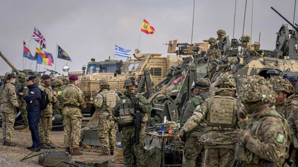 Servicemen stand at the end of the Steadfast Dart 2025 exercise, involving some 10,000 troops in three different countries from nine nations and represent the largest NATO operation planned this year, at a training range in Smardan, eastern Romania, Wednesday, Feb. 19, 2025.  - Sputnik India